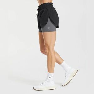NEW! Gymshark Running 2 in 1 Short
Size: XXL - Color: Black and Grey